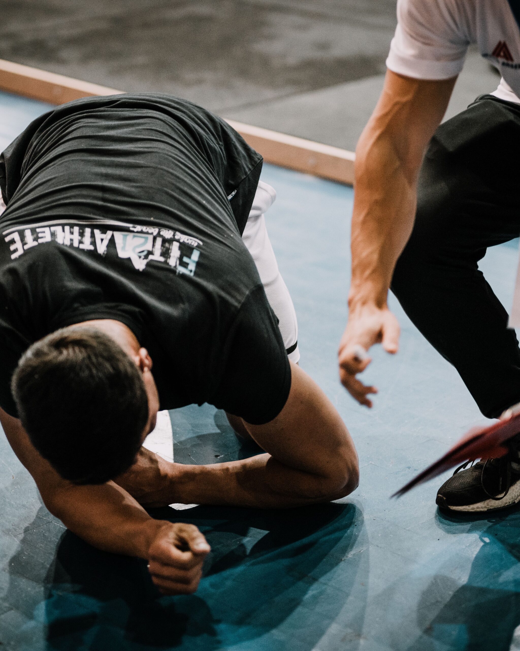 Personal trainer coaching a client one-on-one.